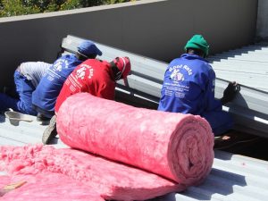Installing pink aerolite insulation
